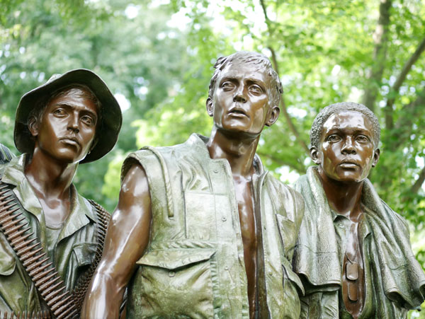 statue of veterans at a memorial